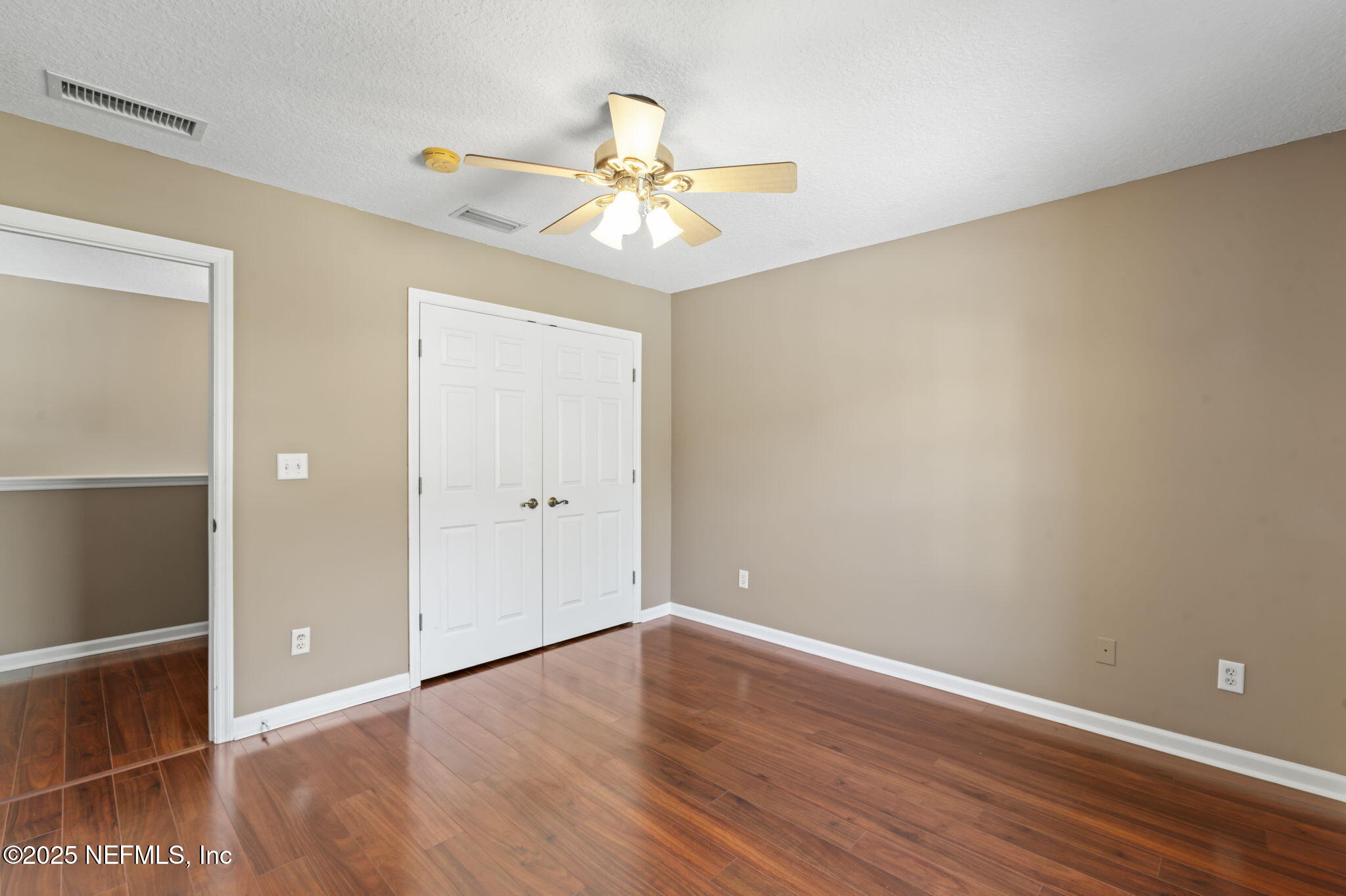 3370 Turkey Creek Drive Green Cove Springs, FL 32043 - Photo 28 of 44 wooden floor in an empty room with a window