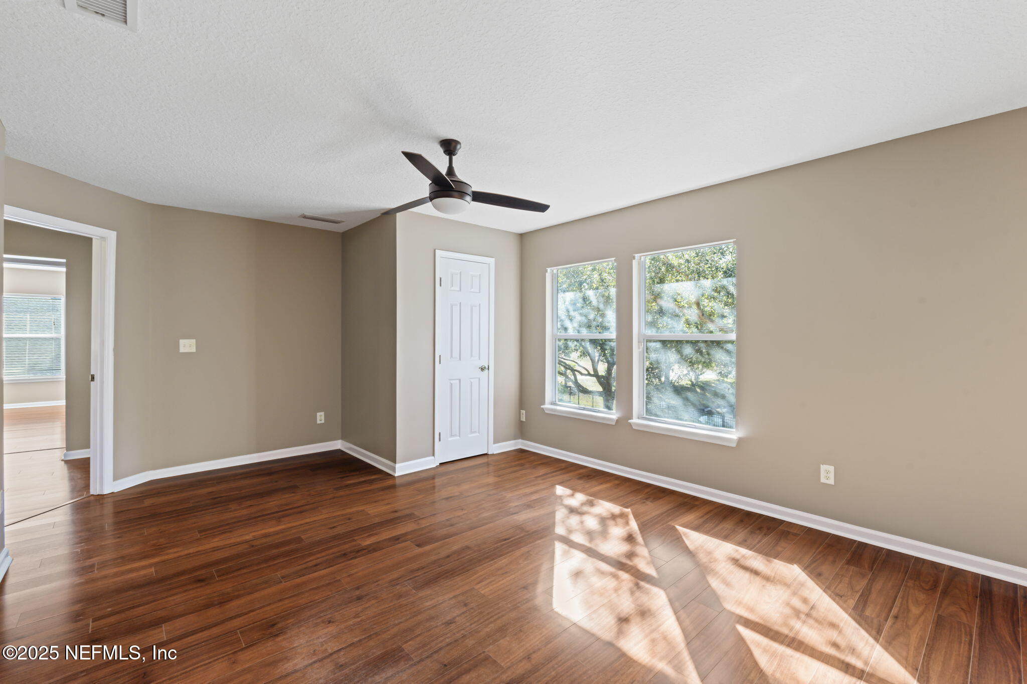 3370 Turkey Creek Drive Green Cove Springs, FL 32043 - Photo 31 of 44 a view of an empty room with wooden floor and a window