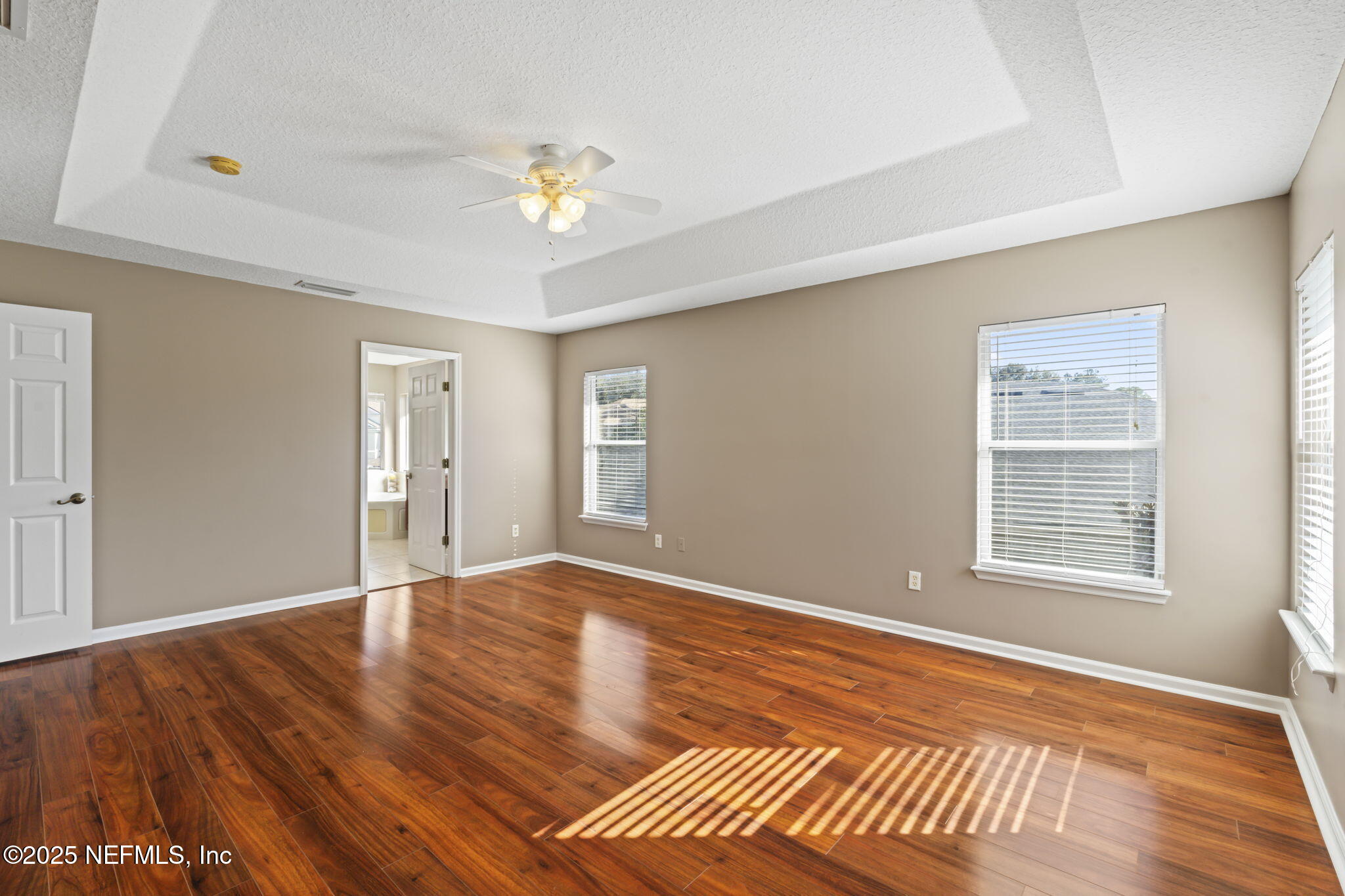 3370 Turkey Creek Drive Green Cove Springs, FL 32043 - Photo 33 of 44 a view of an empty room with wooden floor and a window