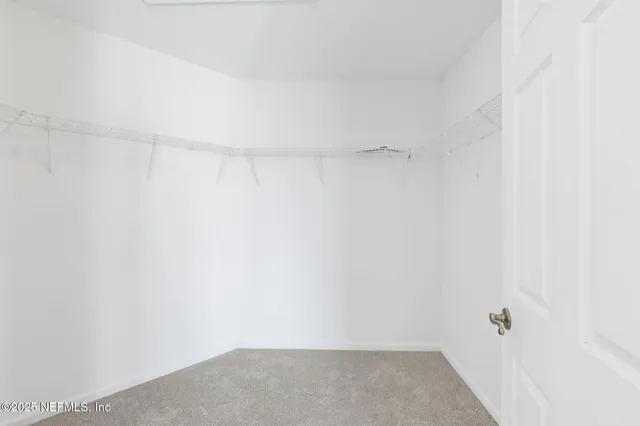 a view of a patio with a dining table and chairs