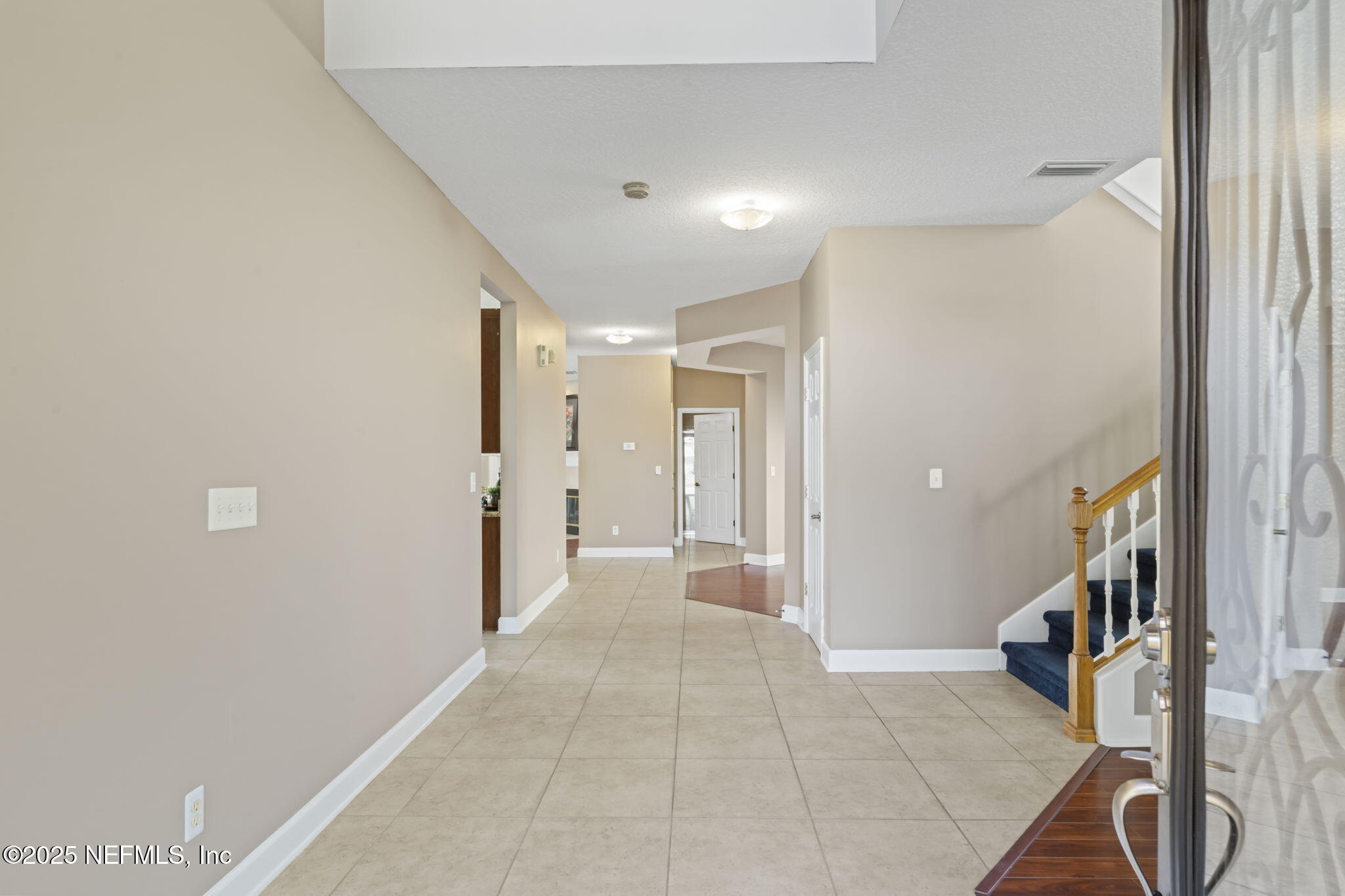 3370 Turkey Creek Drive Green Cove Springs, FL 32043 - Photo 5 of 44 a view of a hallway with wooden floor and staircase