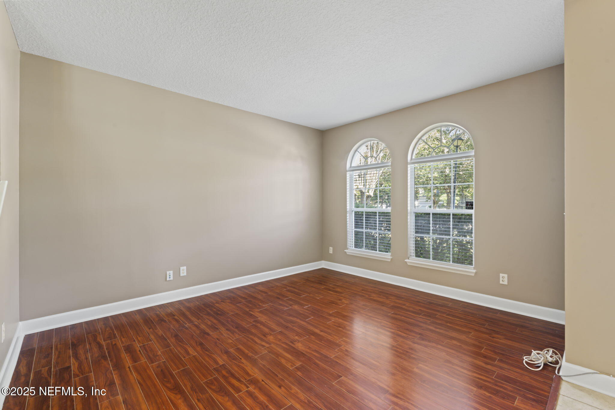 3370 Turkey Creek Drive Green Cove Springs, FL 32043 - Photo 8 of 44 an empty room with wooden floor and windows