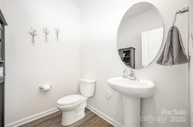 a bedroom with a bed lamp and a window