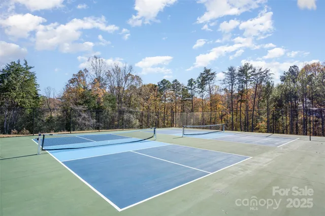 a view of a park with swings and slides