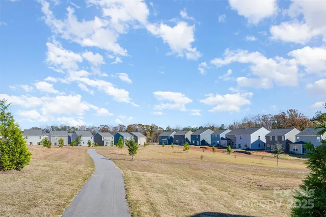 a view of a backyard of the house