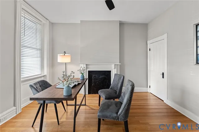 a living room with furniture and a fireplace