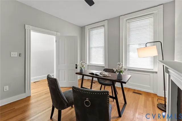 a view of a dining room with furniture and window