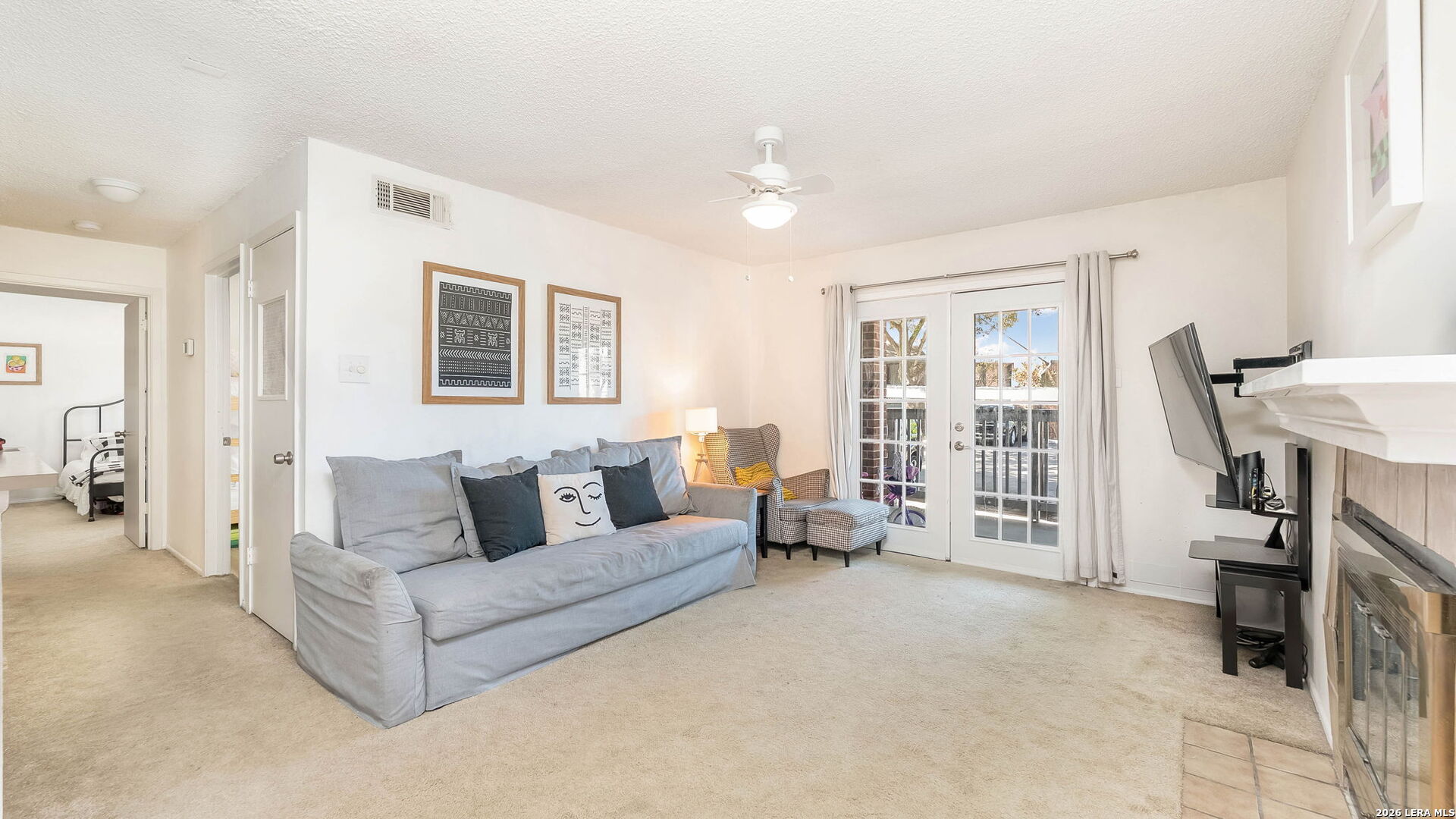 14343 Judson Road, Unit 1201 San Antonio, TX 78233 - Photo 2 of 11 a living room with furniture and a flat screen tv