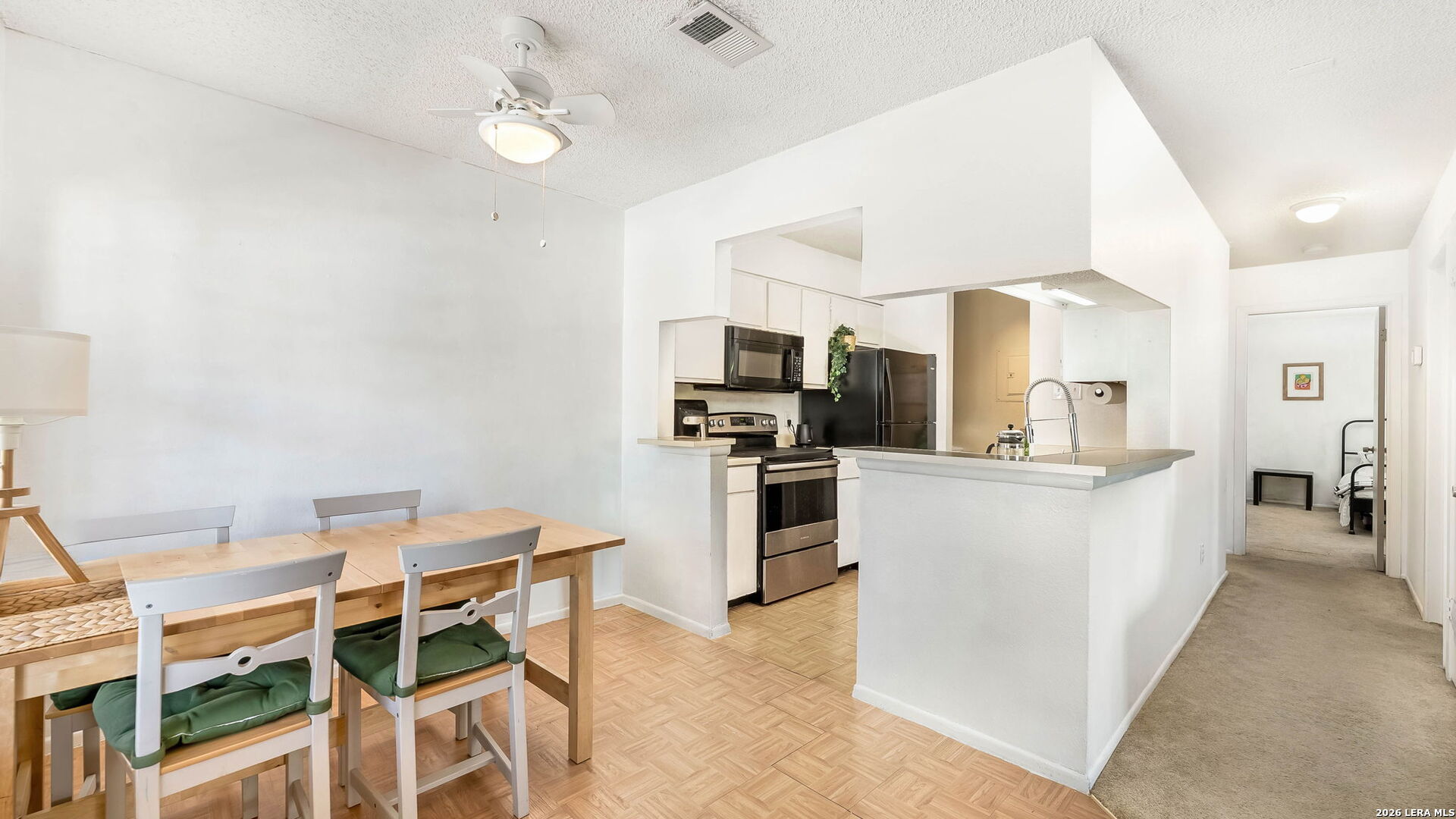 14343 Judson Road, Unit 1201 San Antonio, TX 78233 - Photo 3 of 11 a kitchen with cabinets and stainless steel appliances
