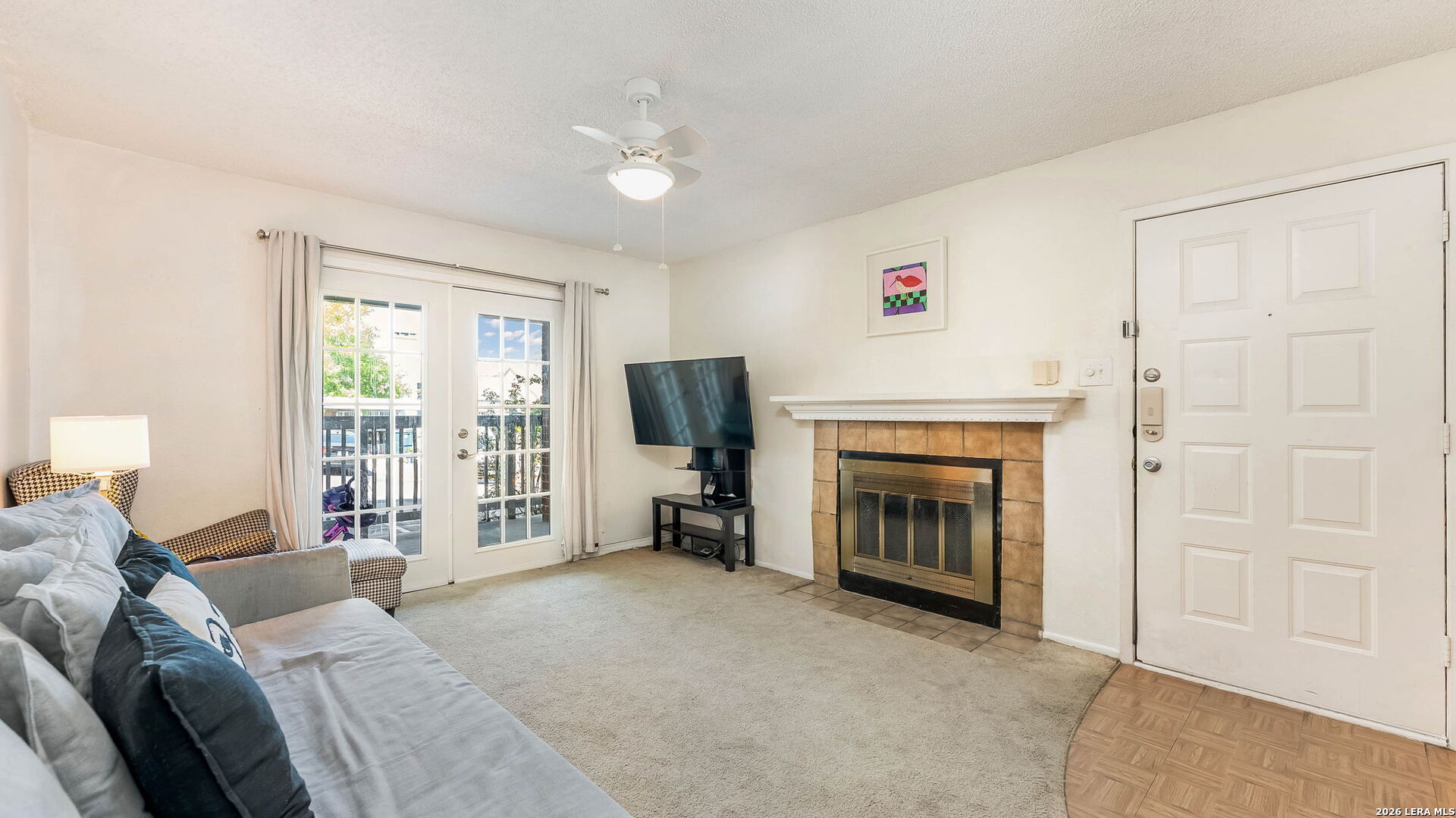 14343 Judson Road, Unit 1201 San Antonio, TX 78233 - Photo 5 of 11 a living room with furniture and a fireplace