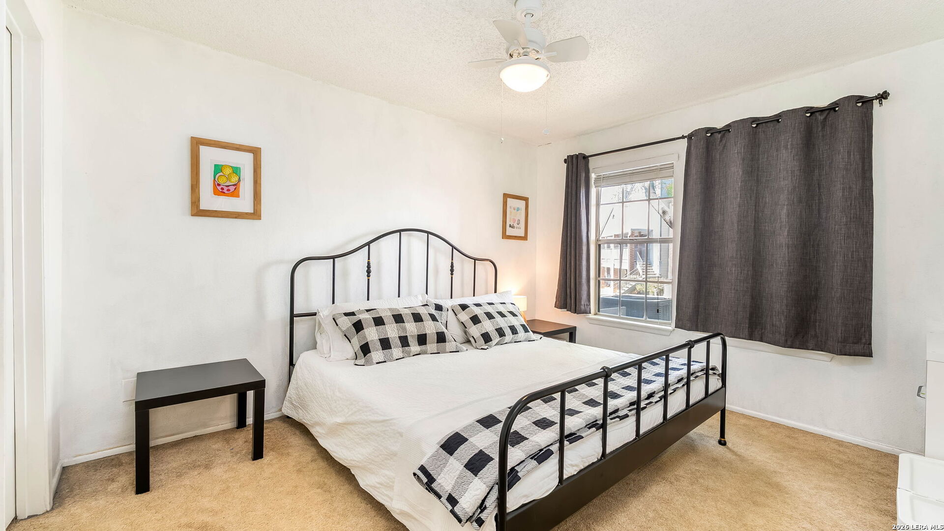 14343 Judson Road, Unit 1201 San Antonio, TX 78233 - Photo 8 of 11 a bedroom with a bed a table and chair