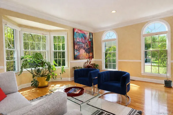 a view of staircase with furniture and a window