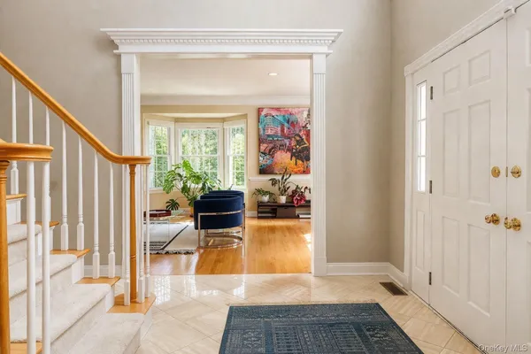 a kitchen with stainless steel appliances kitchen island granite countertop a stove a sink and a microwave