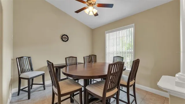 a view of a dining room with furniture and window