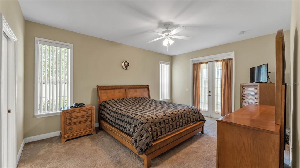 730 Country Walk Cove Eagle Lake, FL 33839 - Photo 15 of 38 a bedroom with a bed and window