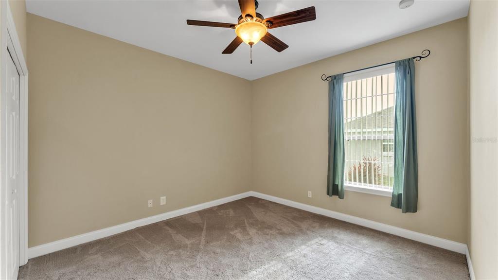 730 Country Walk Cove Eagle Lake, FL 33839 - Photo 22 of 38 a view of room with window and ceiling fan