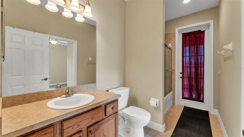 730 Country Walk Cove Eagle Lake, FL 33839 - Photo 25 of 38 a bathroom with a sink and a mirror