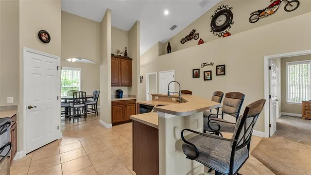 a view of a dining area with furniture and a chandelier