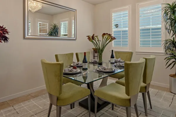 a dining room with furniture and wooden floor
