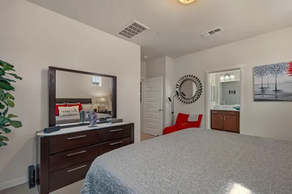 a bedroom with a bed and furniture
