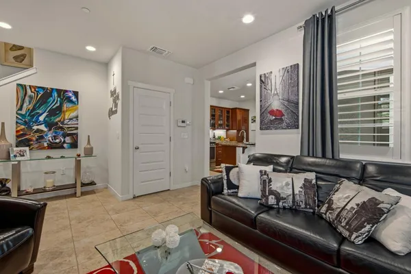 a kitchen with stainless steel appliances granite countertop a stove top oven a sink dishwasher and cabinets