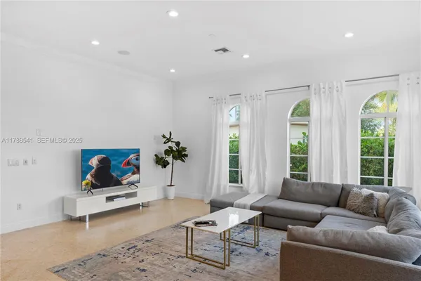 a room with furniture and view of living room