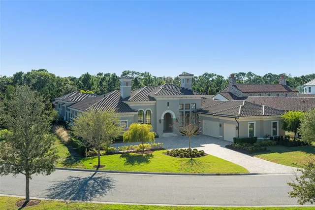 a front view of house with yard and green space