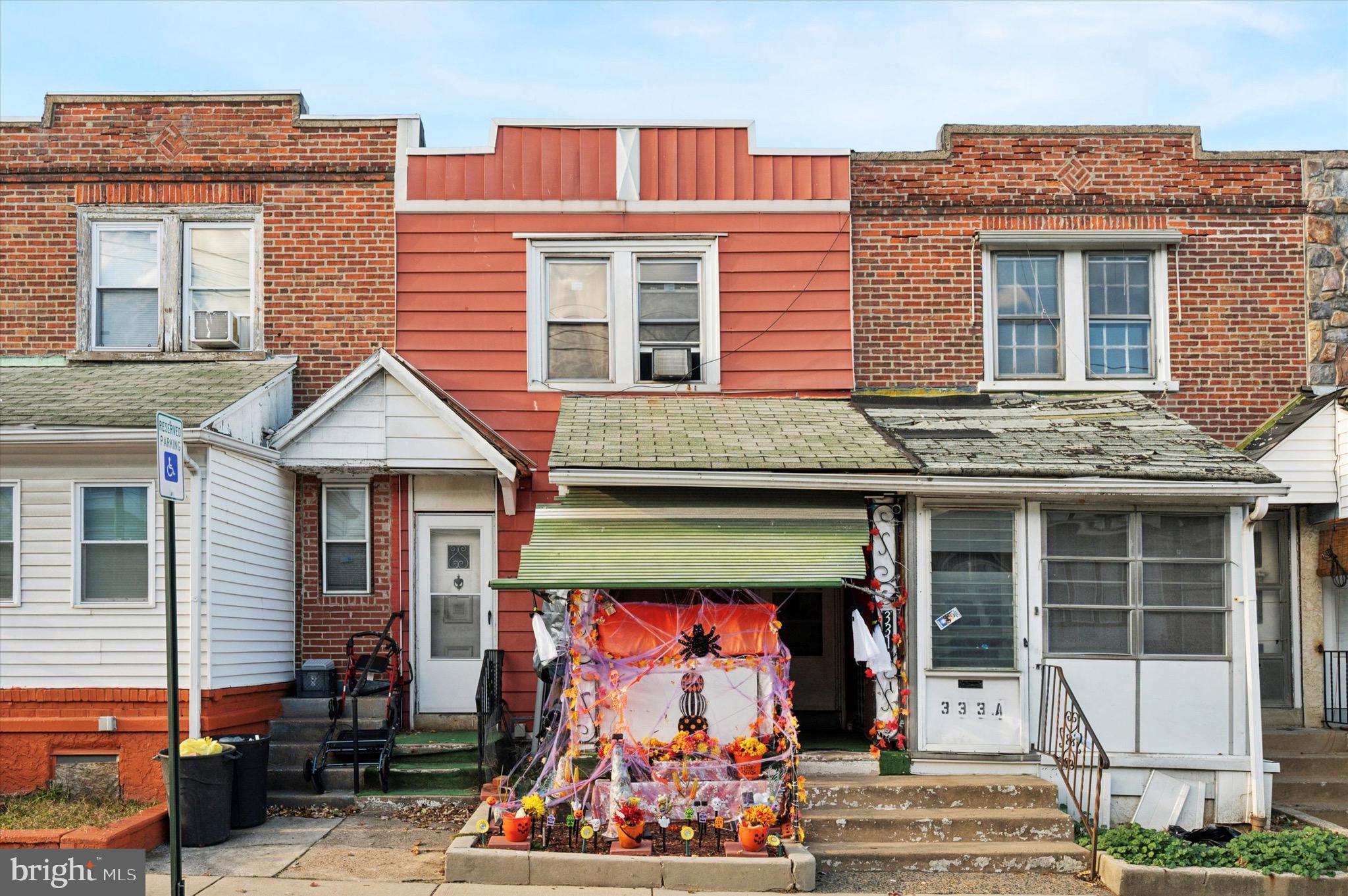331 North 10th Street Darby, PA 19023 - Photo 1 of 15 a group of people sitting in front of a house