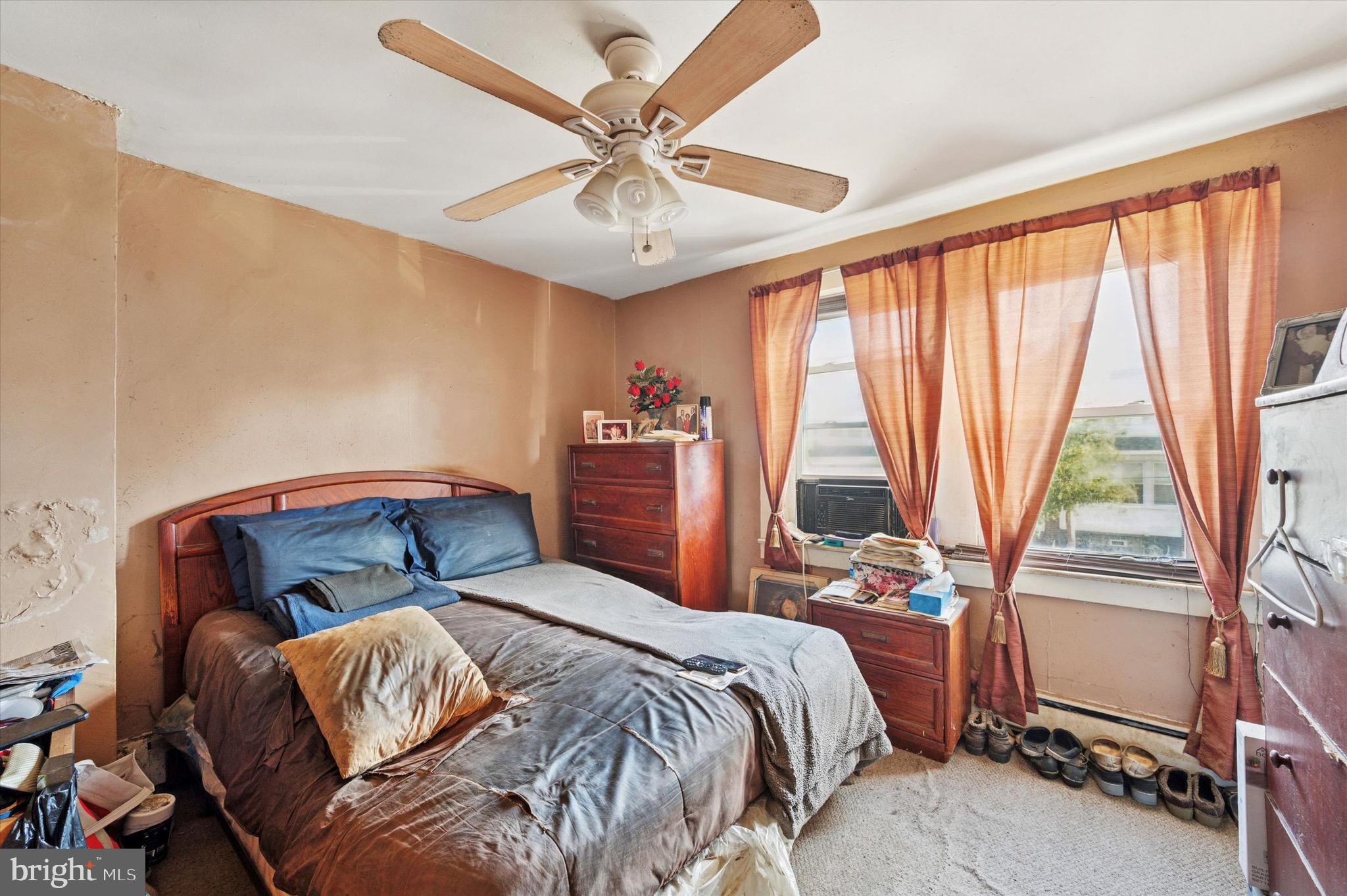 331 North 10th Street Darby, PA 19023 - Photo 12 of 15 a bedroom with a bed and a large window