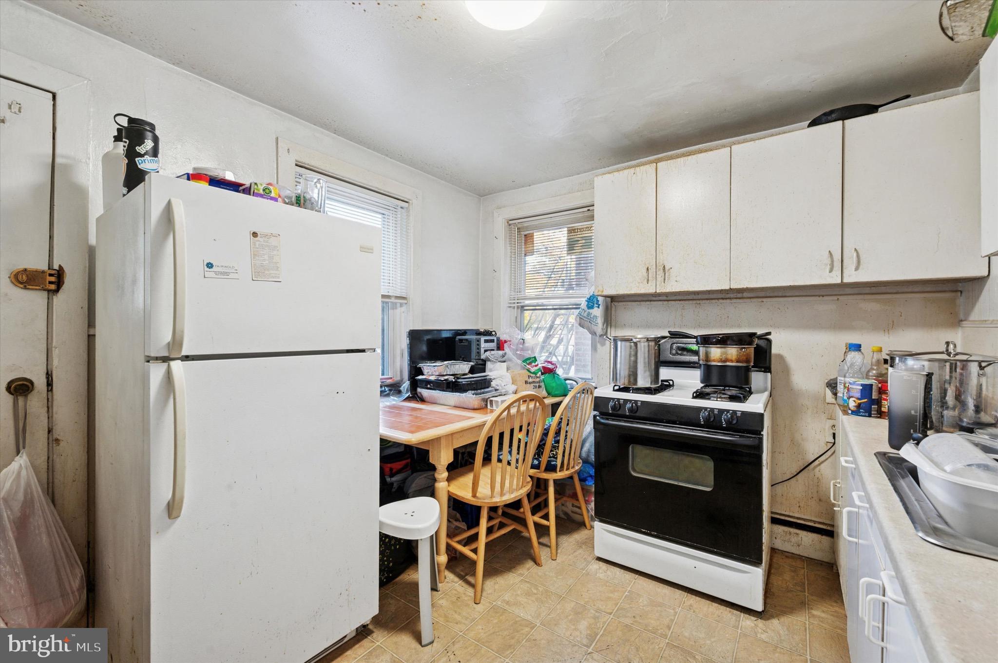 331 North 10th Street Darby, PA 19023 - Photo 6 of 15 a kitchen with stainless steel appliances a stove a refrigerator and a refrigerator