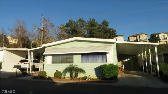 a front view of a house with yard