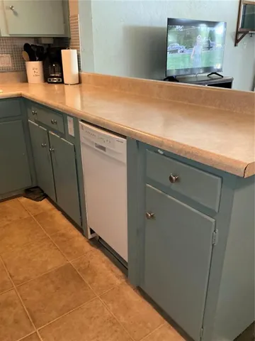 a close view of sink and cabinets