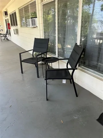 a view of a workspace with furniture