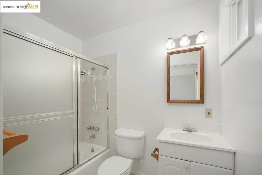 1651 Michael Drive Pinole, CA 94564 - Photo 8 of 21 a bathroom with a toilet a sink and shower