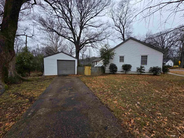 a view of a house with a yard covered in snow