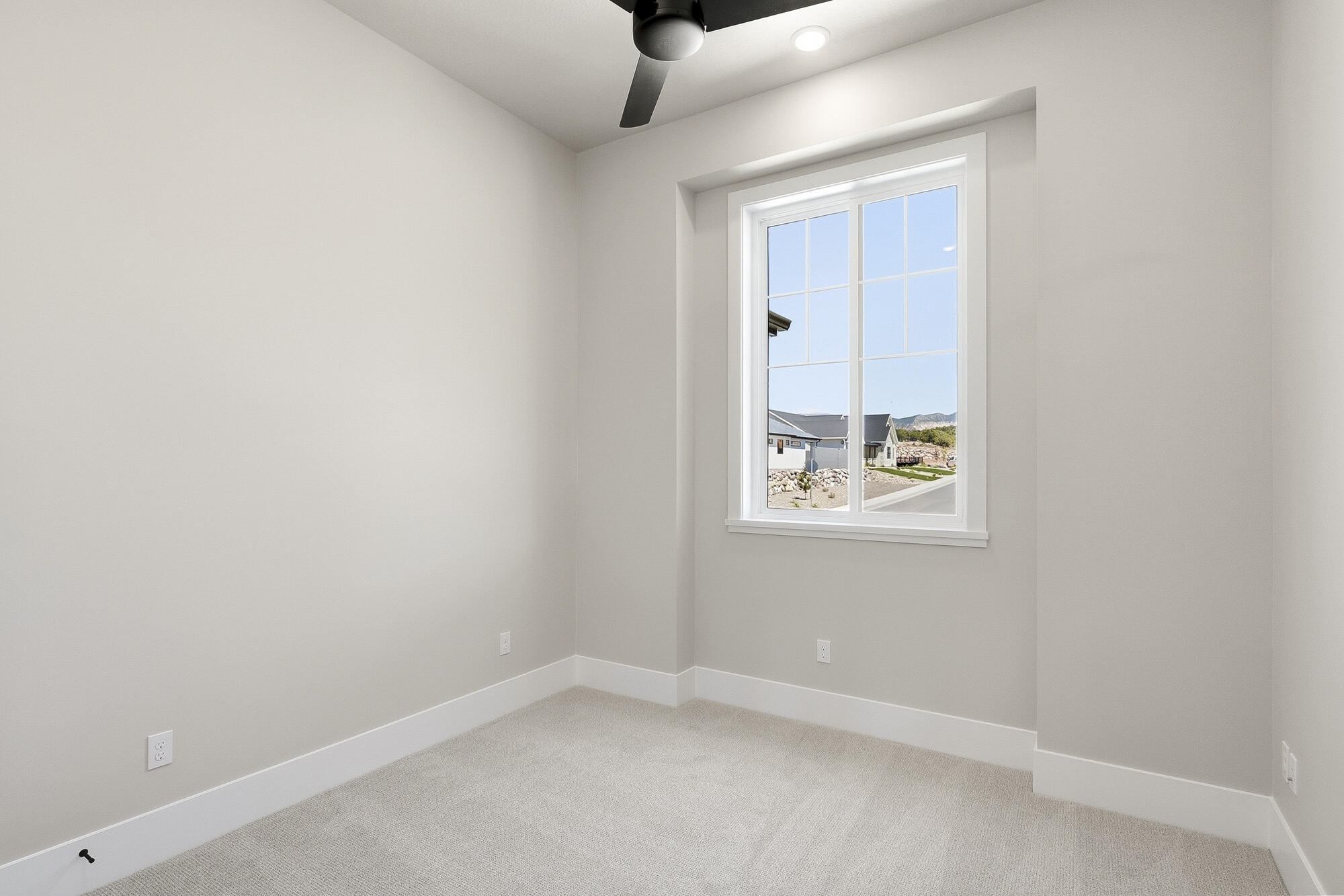 1852 South Hidden Canyon Road Cedar City, UT 84720 - Photo 35 of 79 Positioned near the front of the home, two secondary bedrooms offer peaceful views and flexible space for guests, family, or a home office.