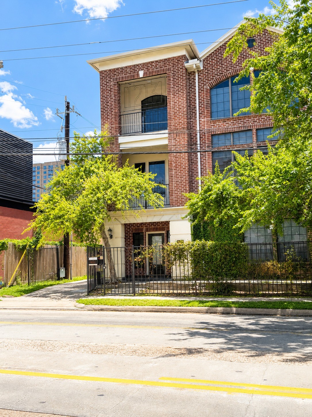 1213 Dunlavy Street Houston, TX 77019 - Photo 1 of 27 a view of a building with a garden and plants