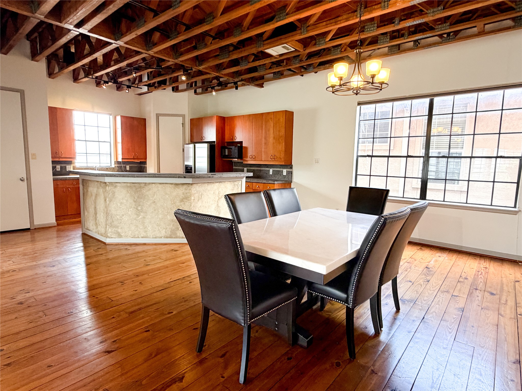 1213 Dunlavy Street Houston, TX 77019 - Photo 12 of 27 a dining room with furniture window and wooden floor