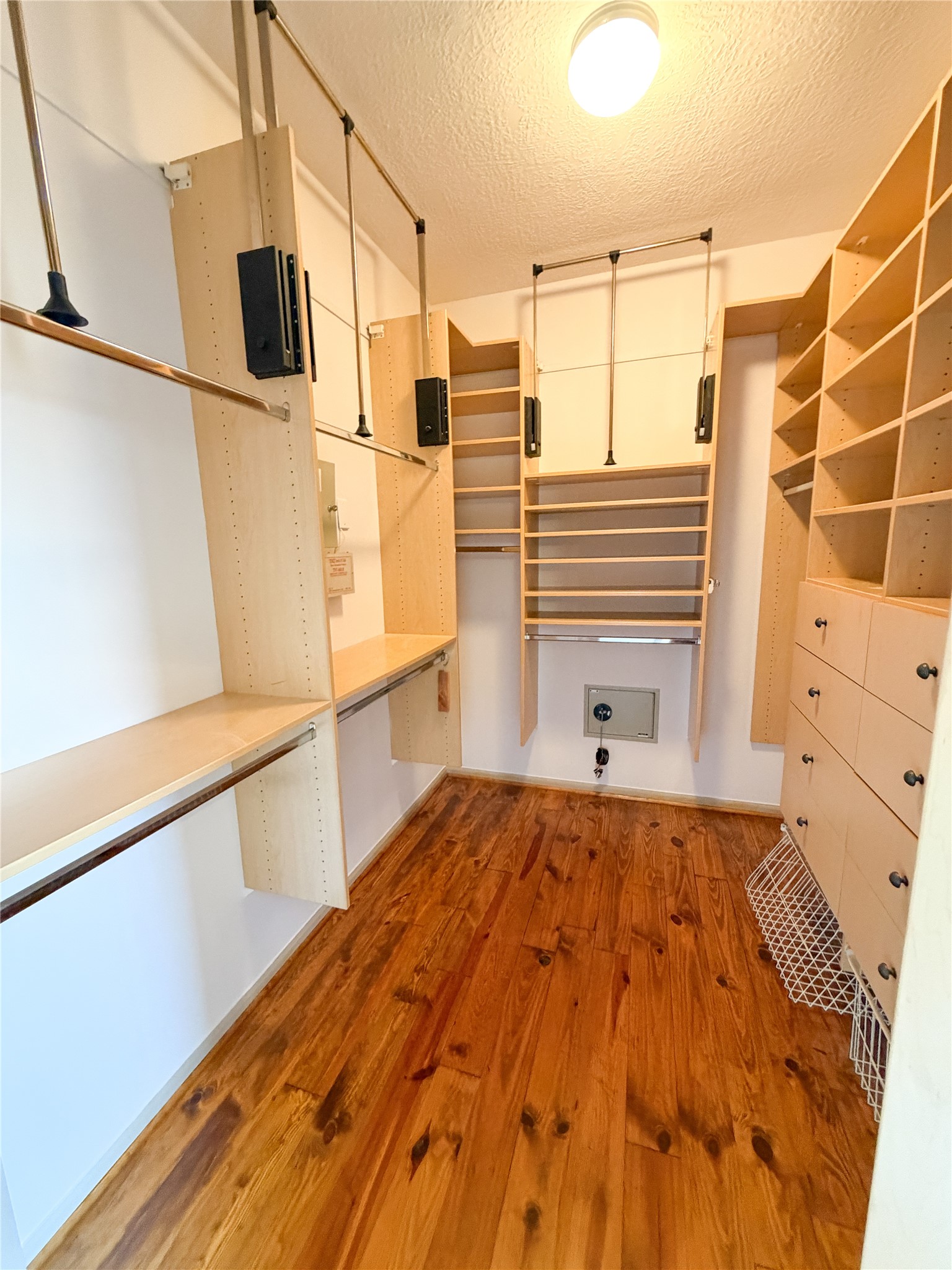 1213 Dunlavy Street Houston, TX 77019 - Photo 21 of 27 a view of a bedroom with wooden floor and cabinet