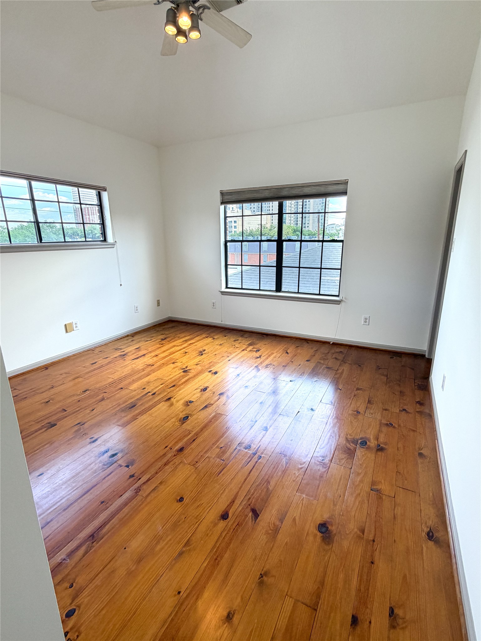 1213 Dunlavy Street Houston, TX 77019 - Photo 25 of 27 wooden floor in an empty room with a window