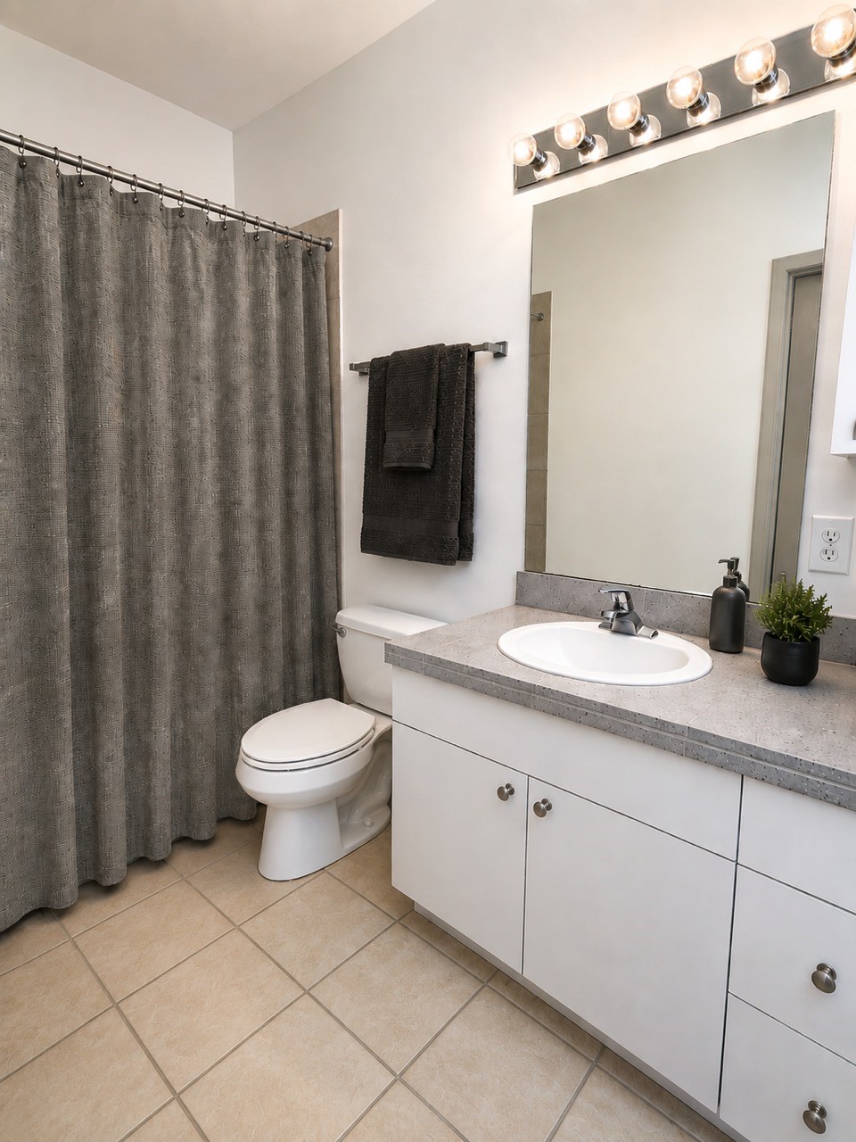 1213 Dunlavy Street Houston, TX 77019 - Photo 26 of 27 a bathroom with a toilet a sink and mirror