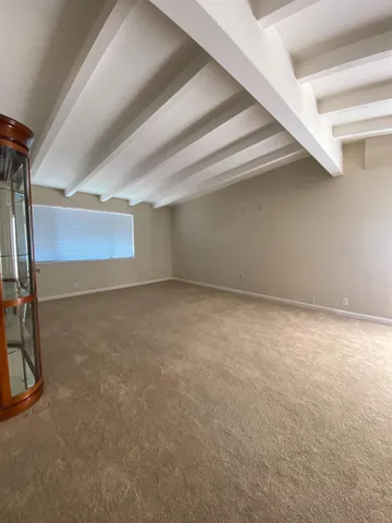 a view of hallway with a mirror