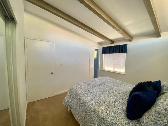 a bathroom with a sink toilet and mirror