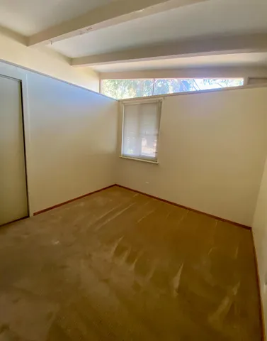 a white toilet sitting next to a shower