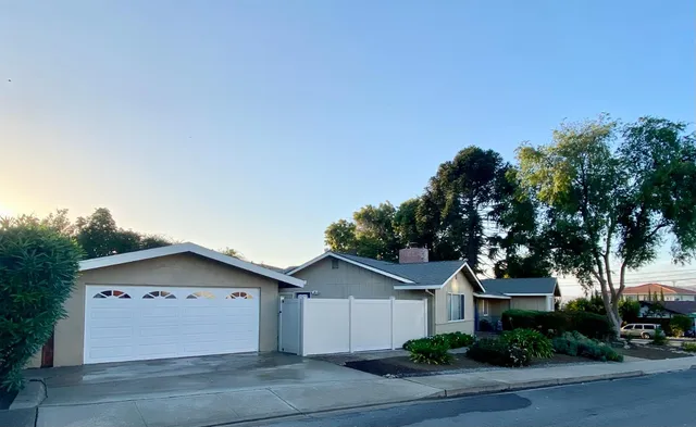a view of house with yard