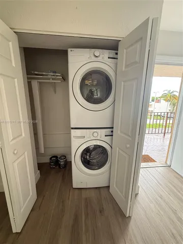 a view of a hallway with washer and dryer