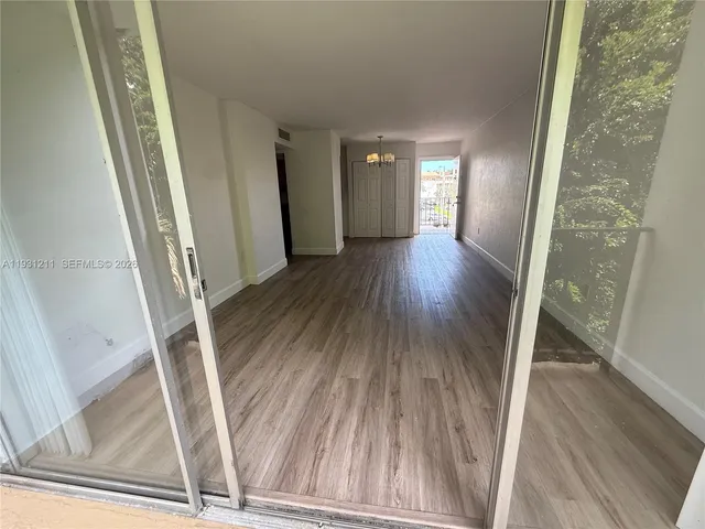a view of entryway with wooden floor