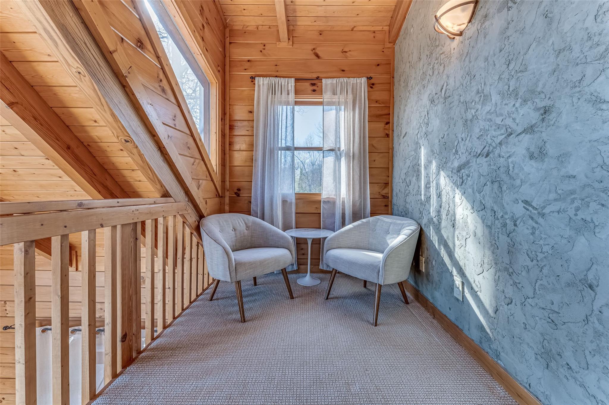 61 North Boundary Rd Mill Spring Mill Spring, NC 28756 - Photo 20 of 46 a balcony with chairs and with potted plants