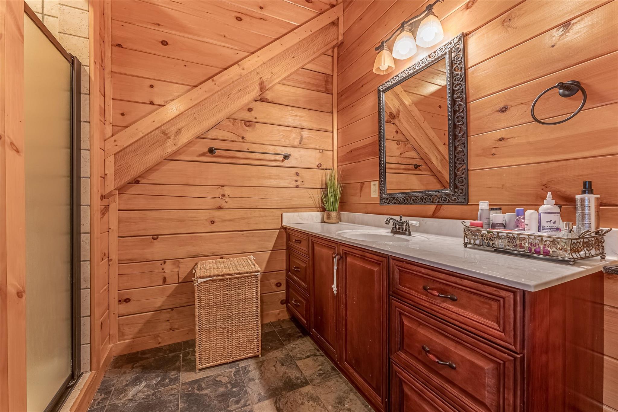 61 North Boundary Rd Mill Spring Mill Spring, NC 28756 - Photo 27 of 46 a bathroom with a sink and a mirror