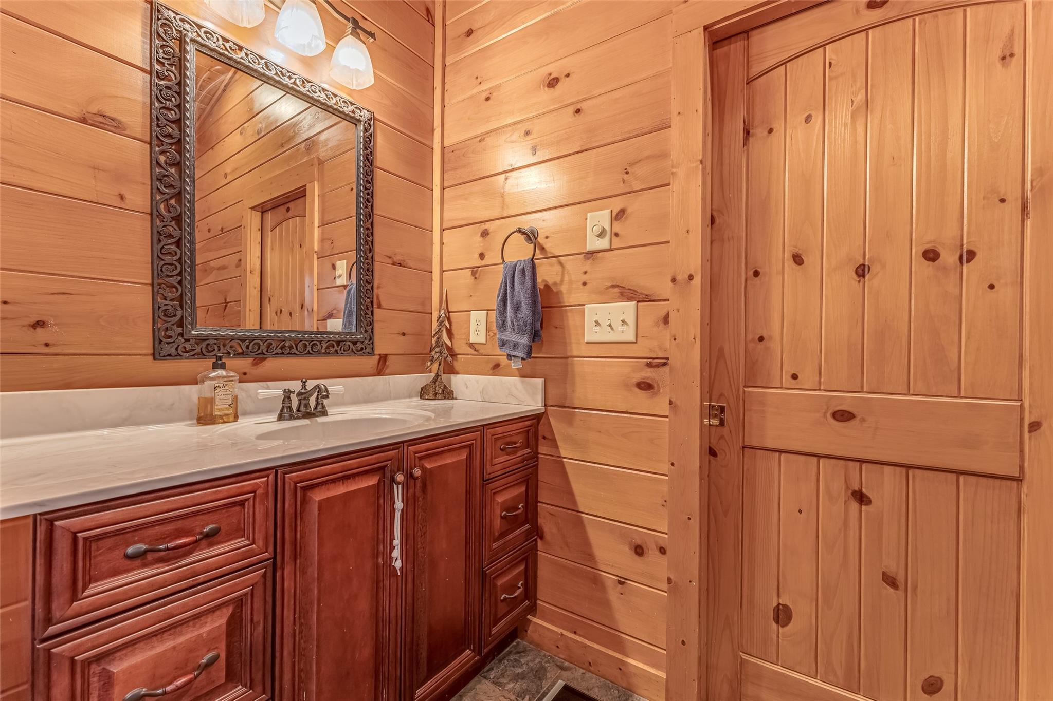 61 North Boundary Rd Mill Spring Mill Spring, NC 28756 - Photo 28 of 46 a bathroom with a sink and a mirror
